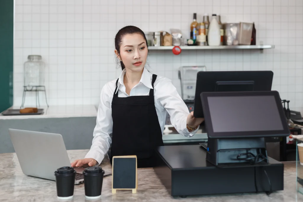 a woman using an f&b pos system in malaysia