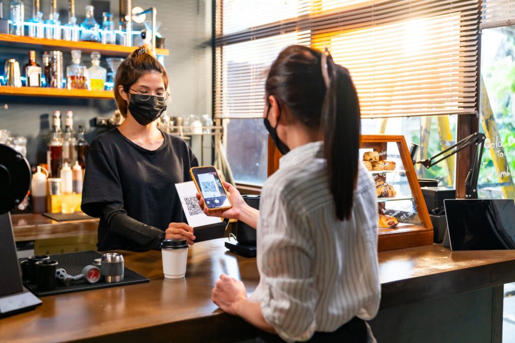 A customer paying via QR payment. Soundboxes are ideal for tracking payments during peak hours.