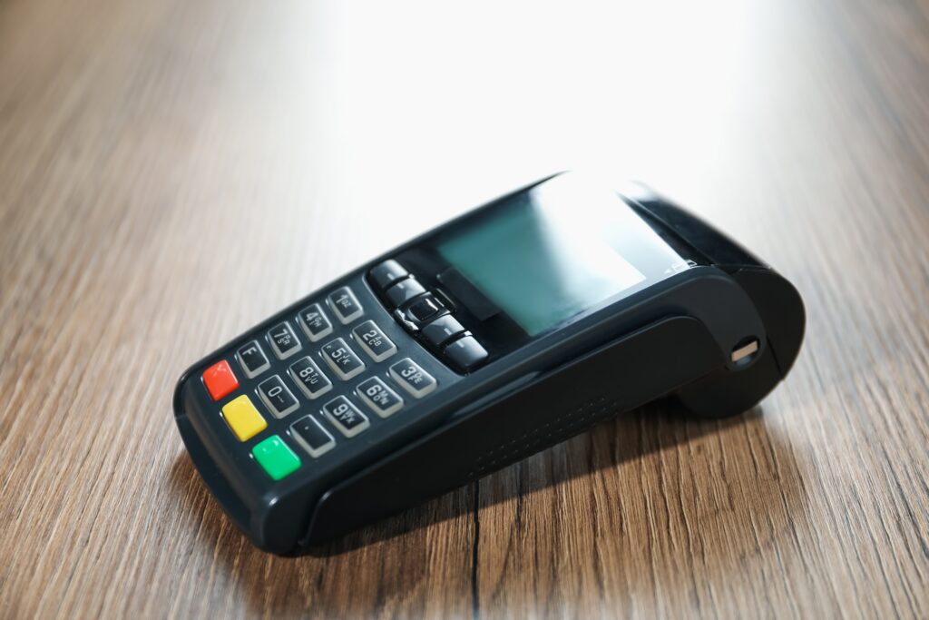 A payment terminal. Business owners should compare POS system specifications before deciding on one.